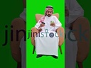 khaliji saudi arab man from gulf shopping online on his mobile while sitting in the living
