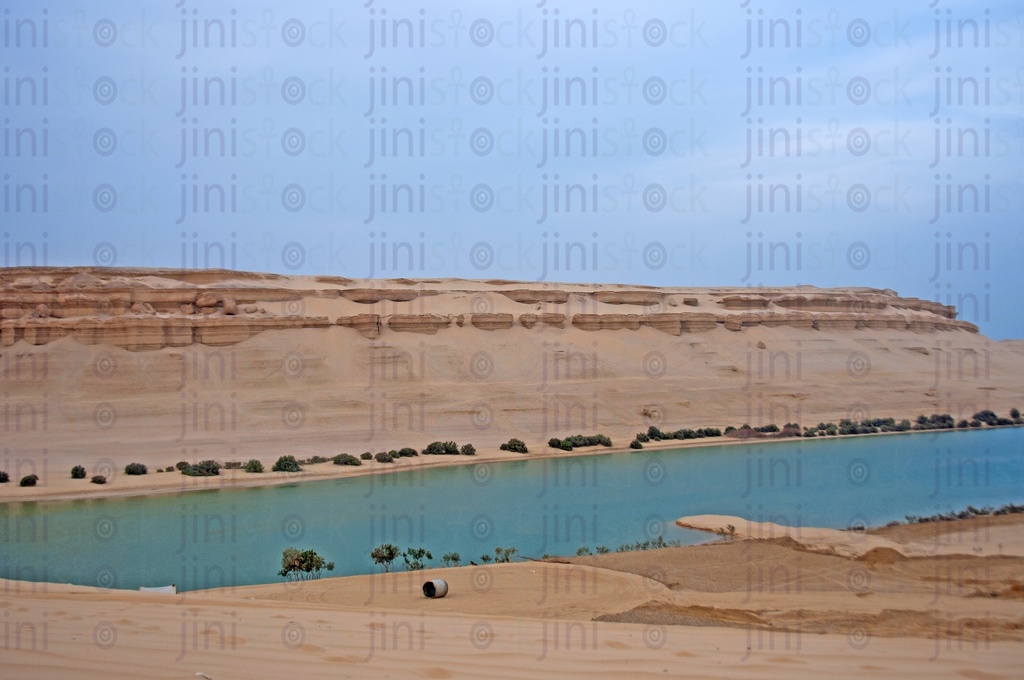 The Magic Lake in Fayoum. a Mountain, sands, and a lake in the desert of Fayoum, Egypt: البحيرة المسحورة بالفيوم