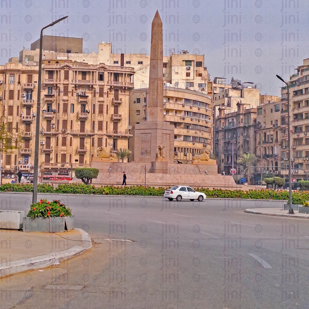 The obelisk,and Rams in Tahrir Square, Cairo, Egypt, and the Street was empty of cars, and is used as a background for designs on Cairo streets