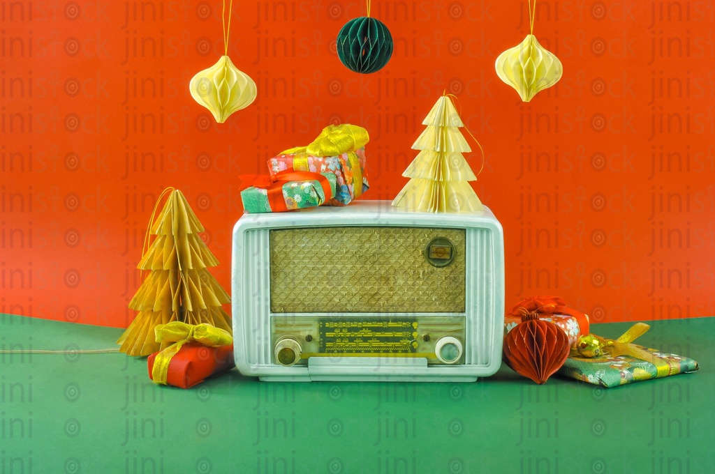 A vintage radio between Christmas and New year ornaments