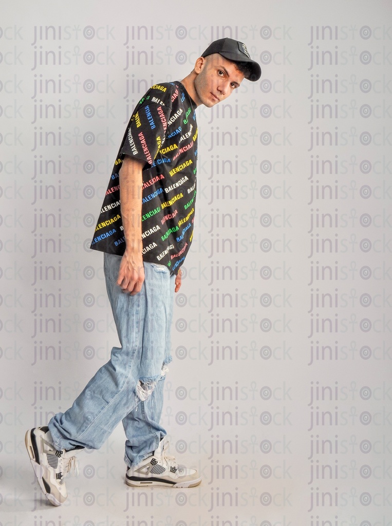 A cool Egyptian man walking side view.