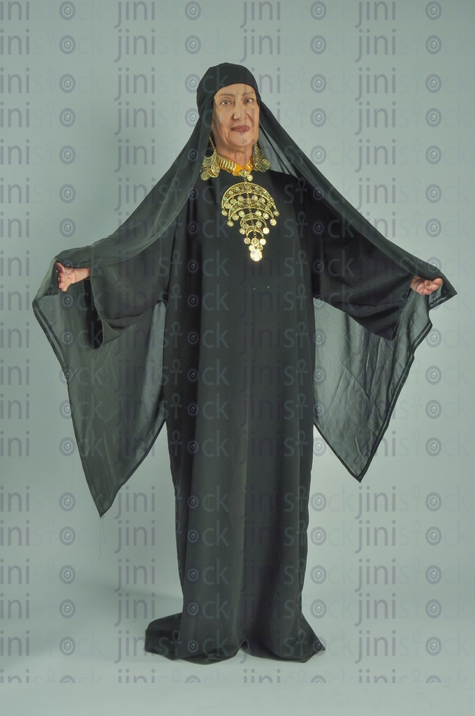 upper Egypt woman holding her hair's veil with her hand