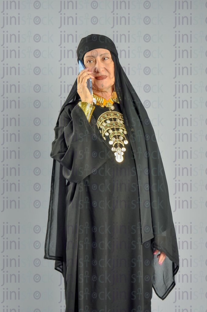 An upper Egypt woman talking on the mobile phone.