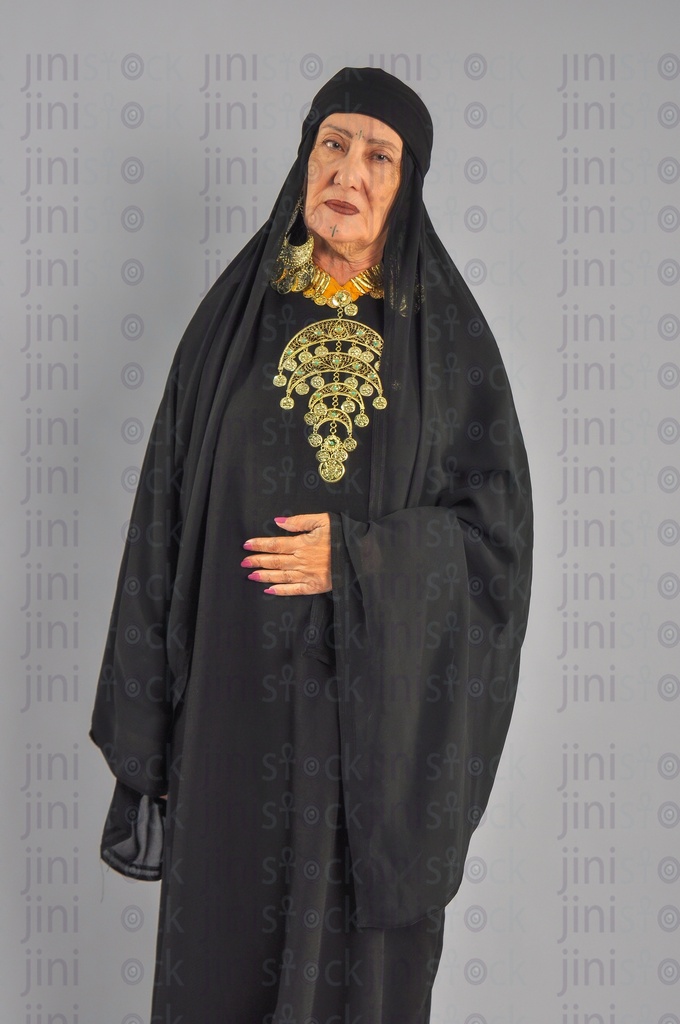 An upper Egypt woman or woman from the Egyptian countryside putting her hand on her stomach or suffers from stomach or abdominal pain