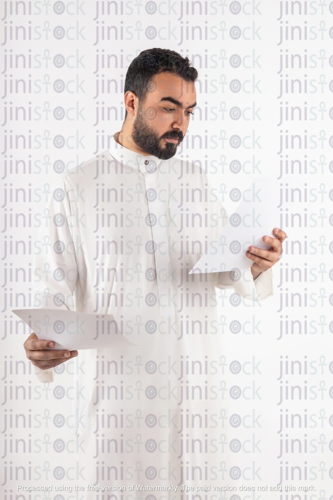 saudi or khaliji man looking at work papers