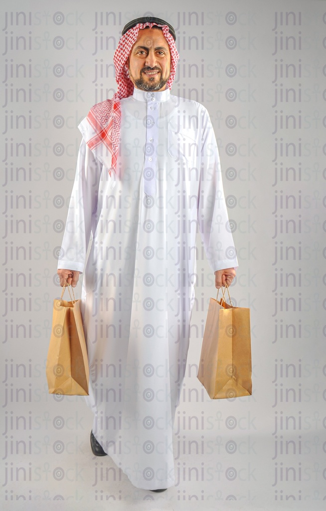 Saudi or Emirati or Khaliji man holding the shopping bags