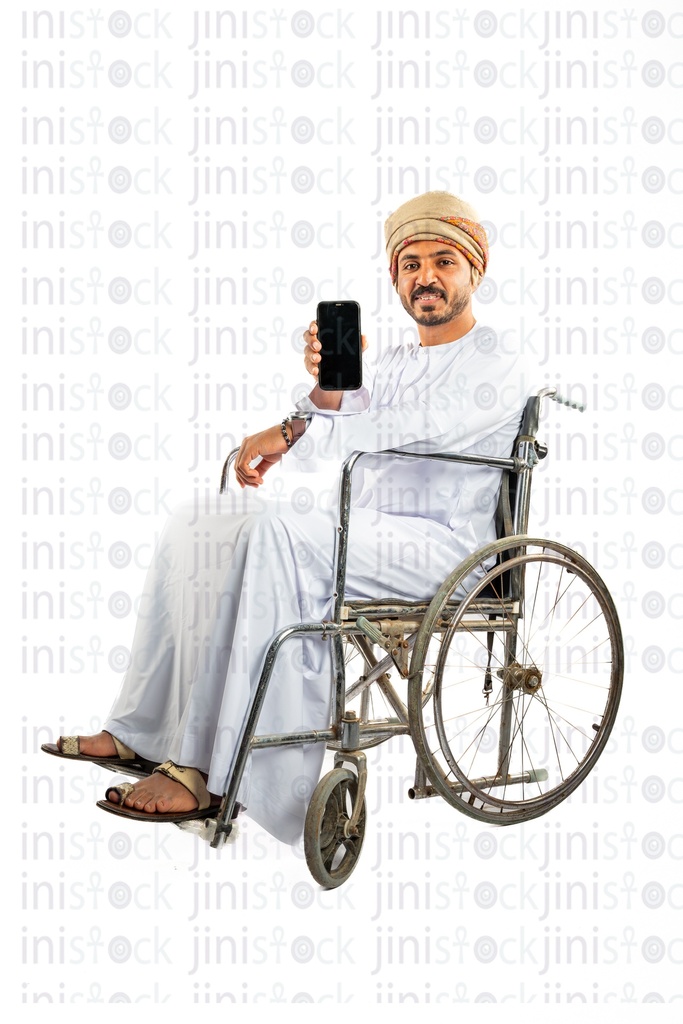 omani arab khaliji man from gulf on a wheelchair holding mobile application