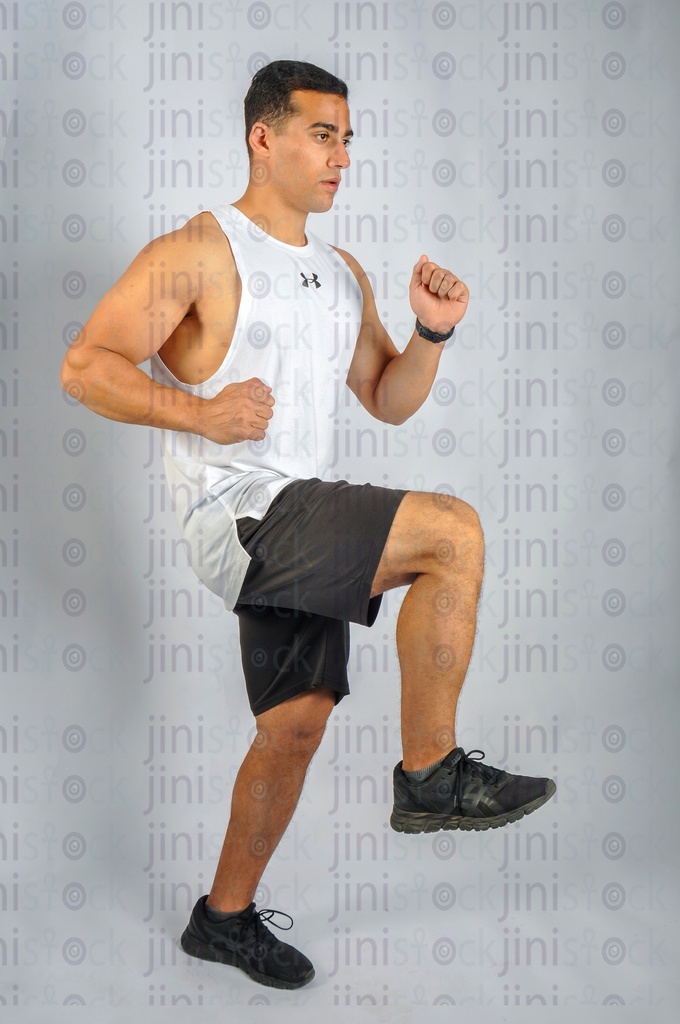 Young athlete playing sport or working out in a gym