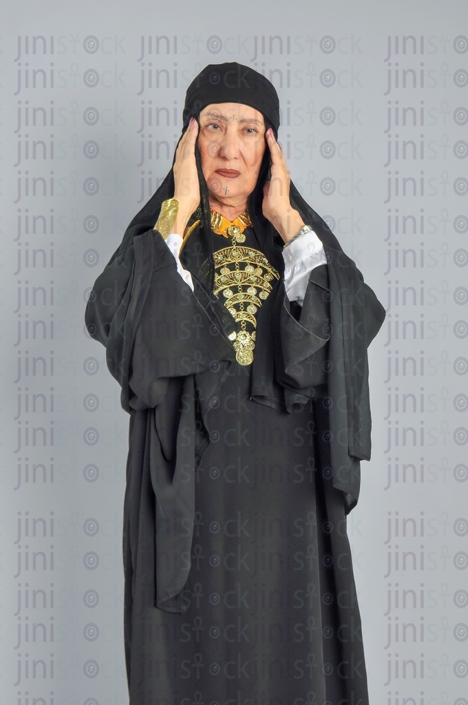 An upper Egypt woman has a headache.