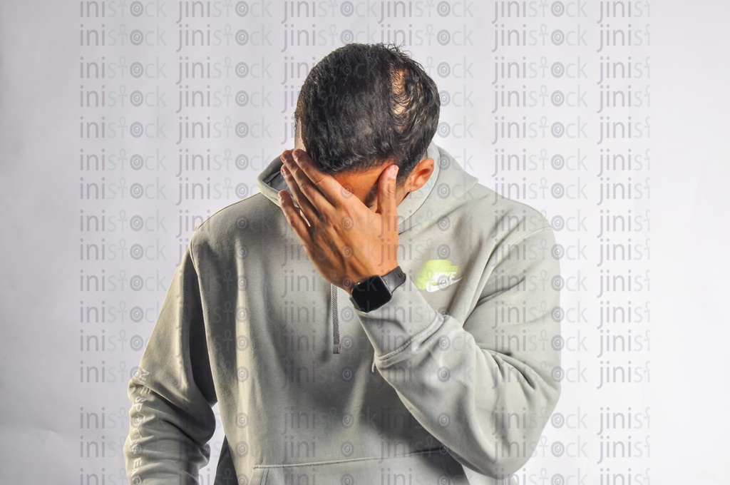 Egyptian man has a headache or fever