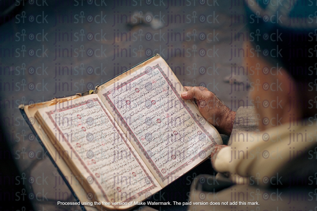 old Egyptian Muslim man reading Quran Muslim