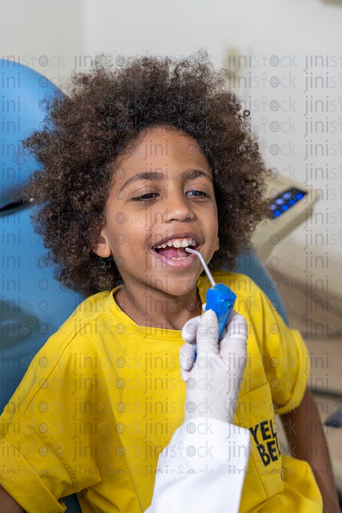 Boy happy while sitting in the dental chair