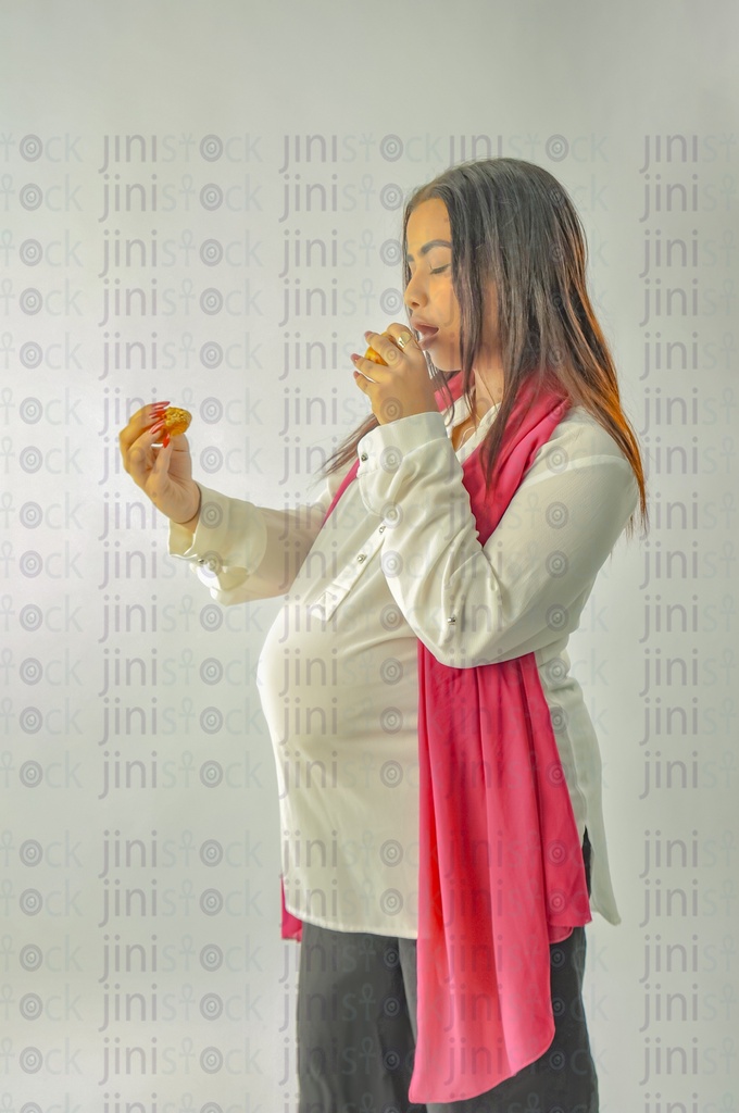 Pregnant Egyptian woman eating food