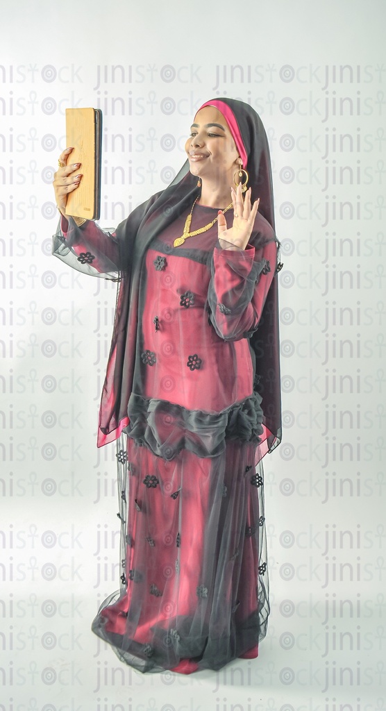 A Nubian Egyptian girl wearing Nubian clothes making a video call