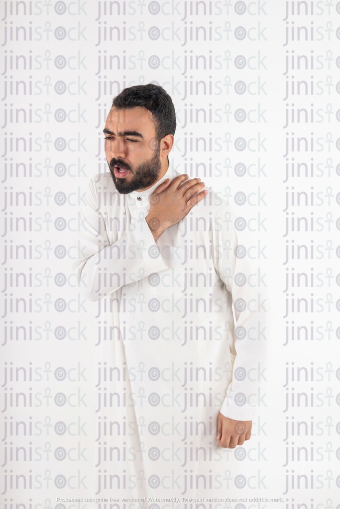 a stock image with high quality for a gulf  saudi khaliji man holding his shoulder from pain
