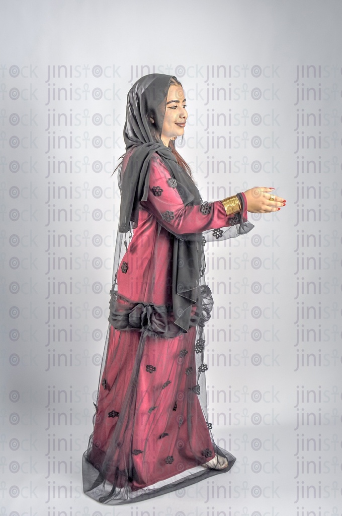 A farmer or a Nubian woman from Egypt wearing Nubian clothes checks hand