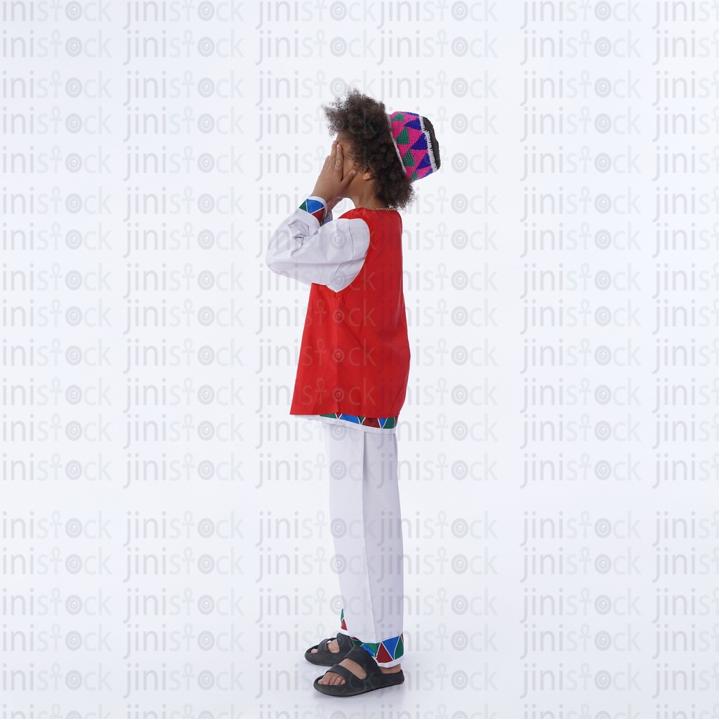 nubian boy with curly hair like bakr side view covering his eyes