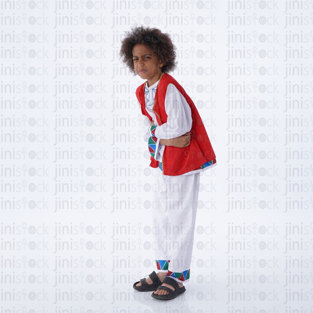 Nubian boy with curly hair with stomach pain