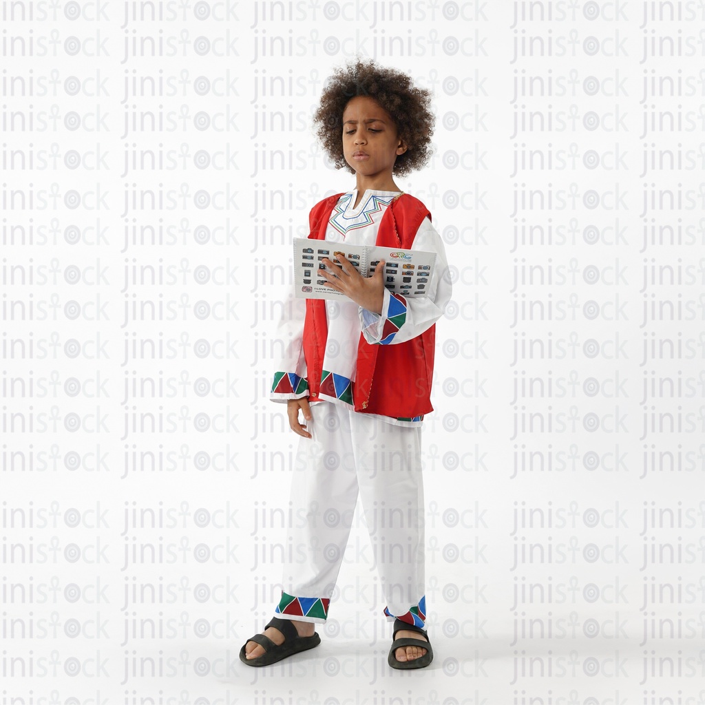 Nubian boy reading in a book