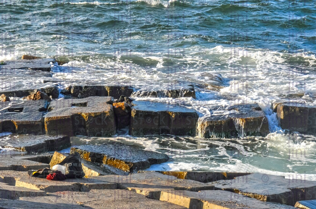 A beach and waves in Alexandria- Alexandria Corniche beach at sunset.