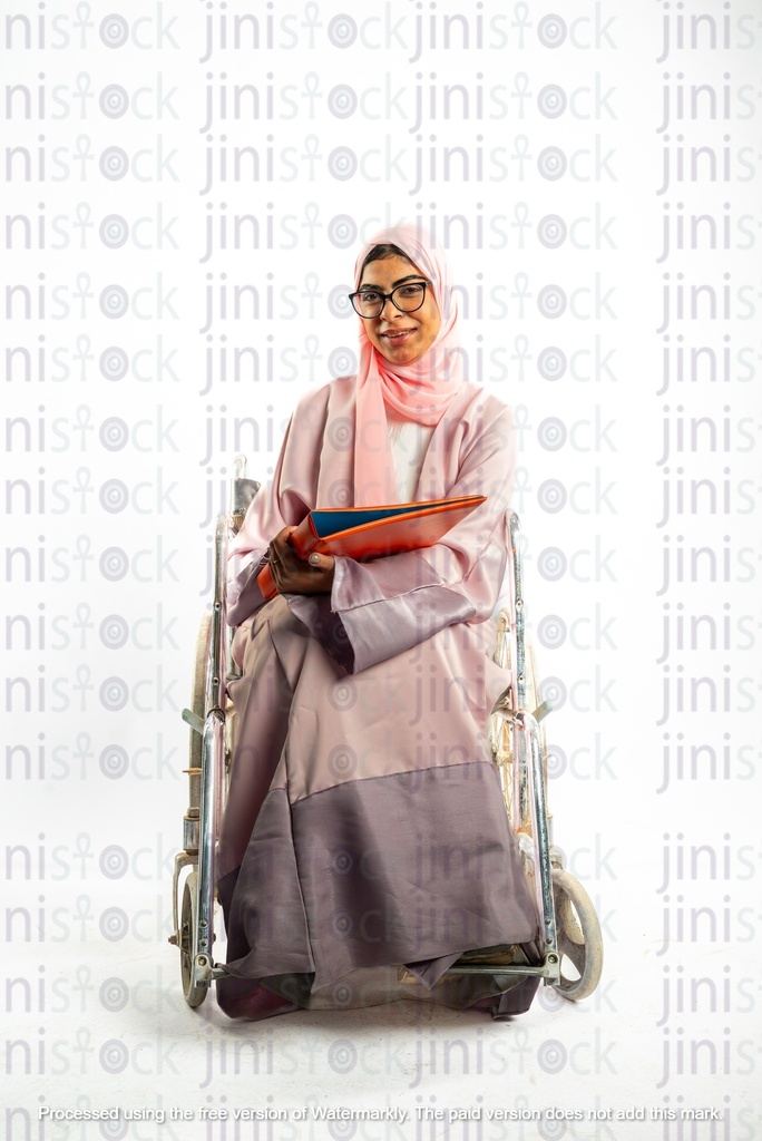 saudi khaliji woman from the gulf on a wheel chair disabled and holding a work file or folder
