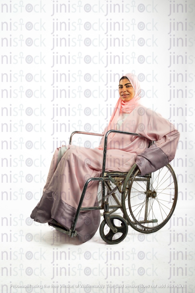 saudi khaliji woman from the gulf on a wheel chair disabled and looking to the camera