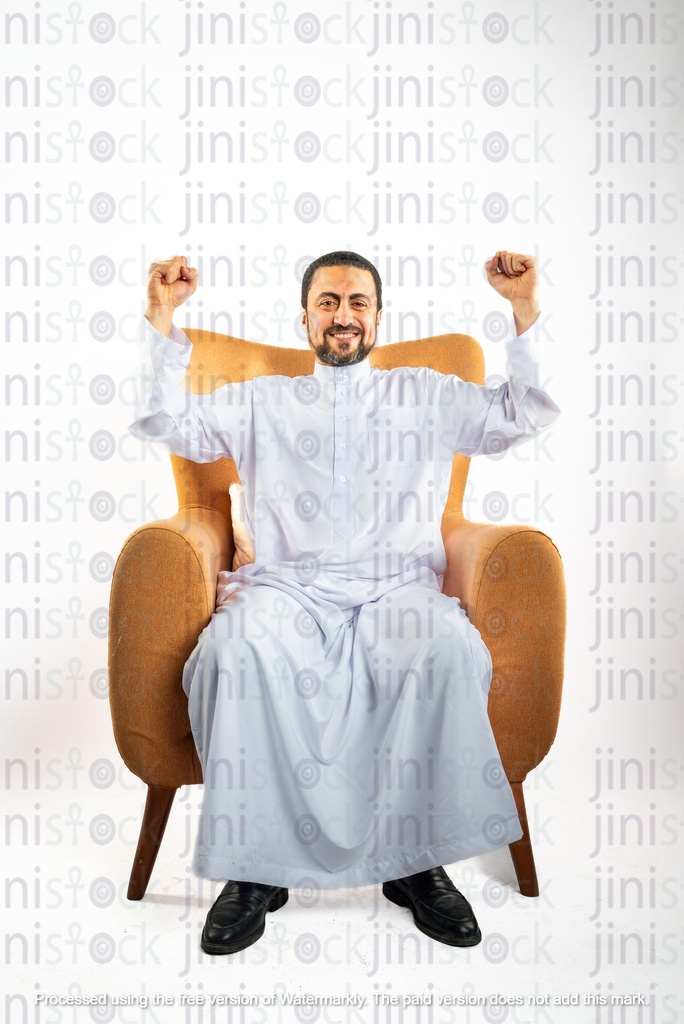 saudi khaliji man from gulf happy cheering while sitting on a chair