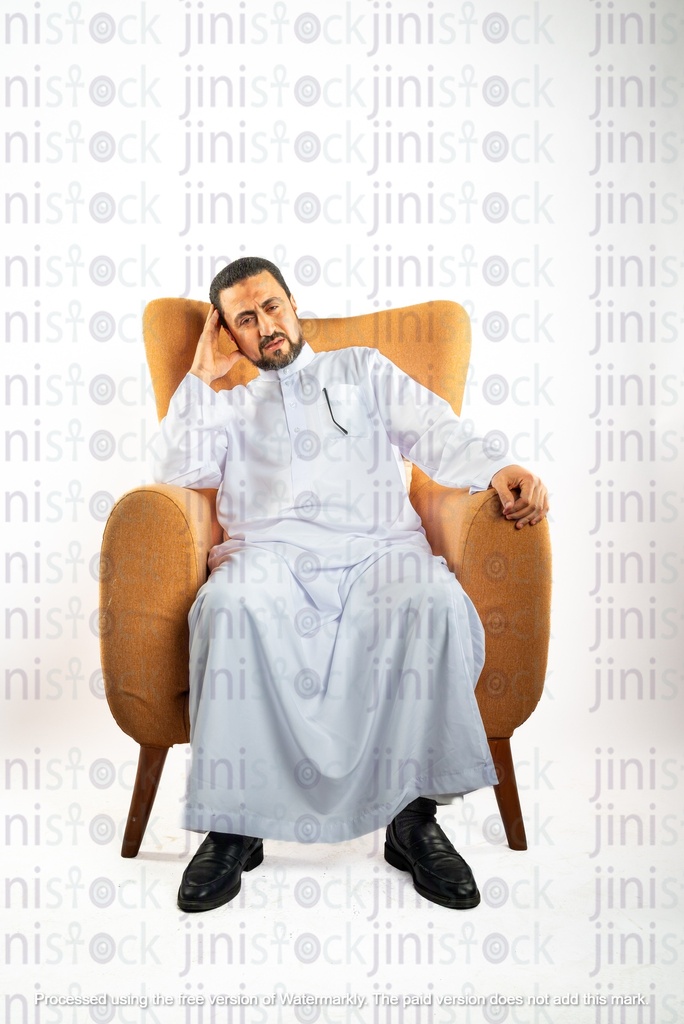 saudi khaliji man sitting on the chair  tired and with headache