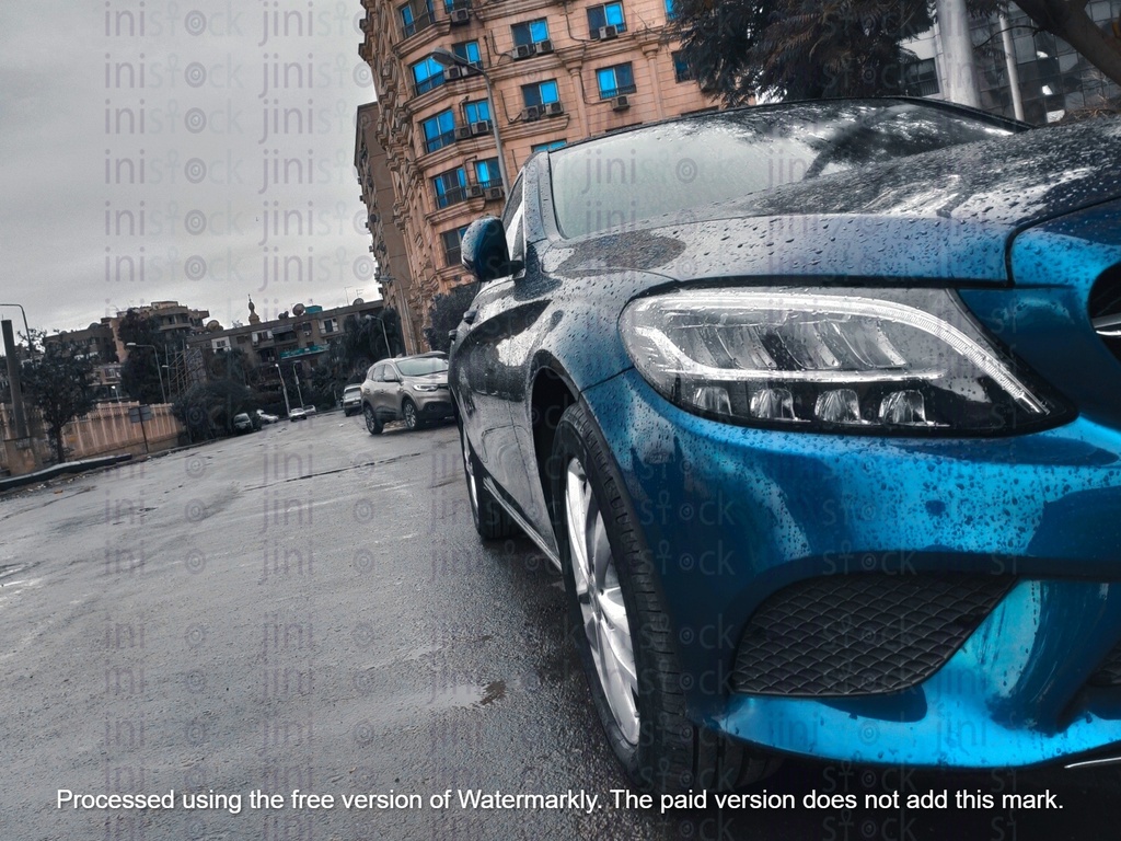 cool blue car parked on a road