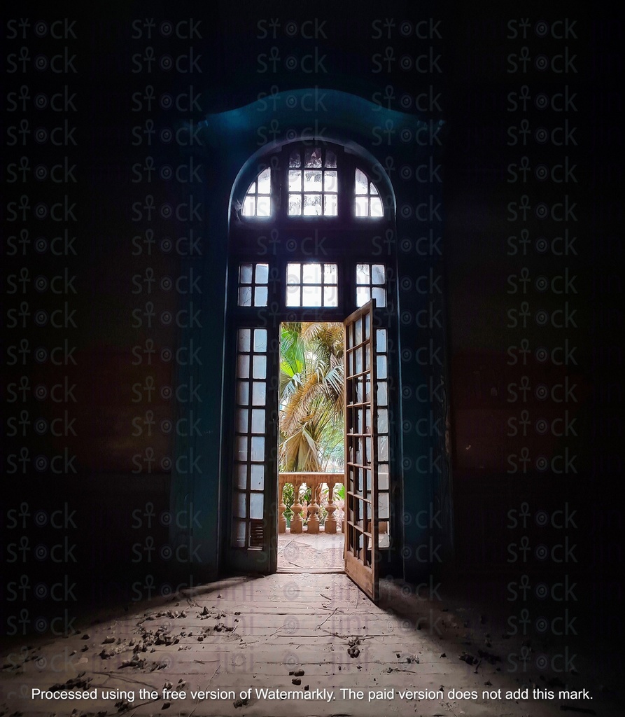 doorway with blue door inside a dark house