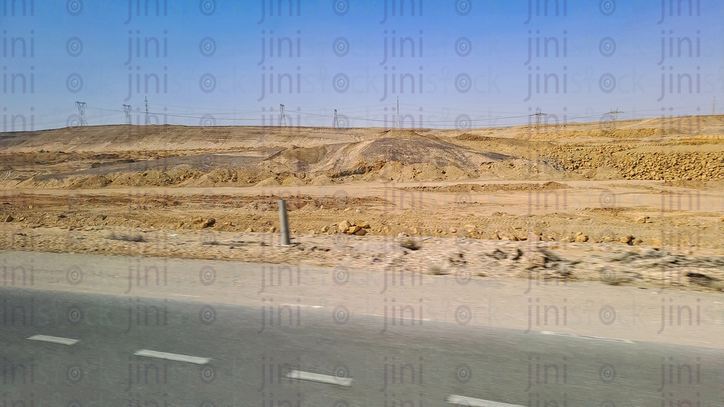 Mountains and an empty Road with no cars or buses on a traveling road in Egypt