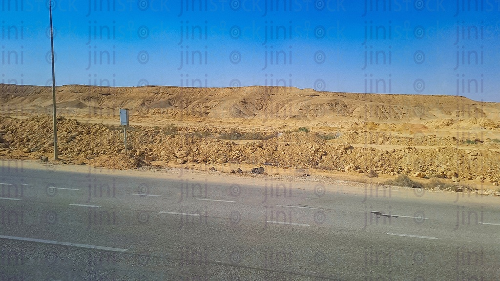 Mountains and an empty Road with no cars or buses on a traveling road in Egypt