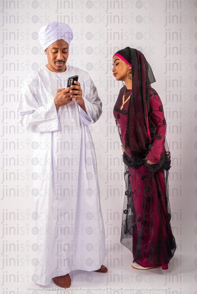 Egyptian Nubian woman trying to check her husband mobile