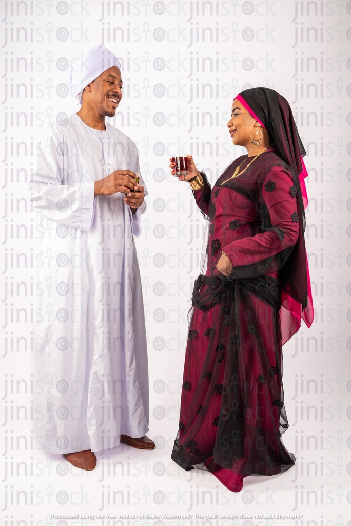 Egyptian man and woman drinking tea and talking