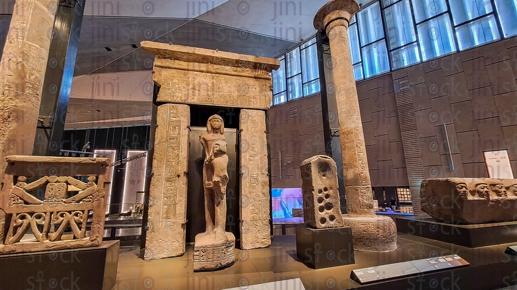Monuments and archaeological statues and a column in the Grand Egyptian Museum in Al Ramaya square