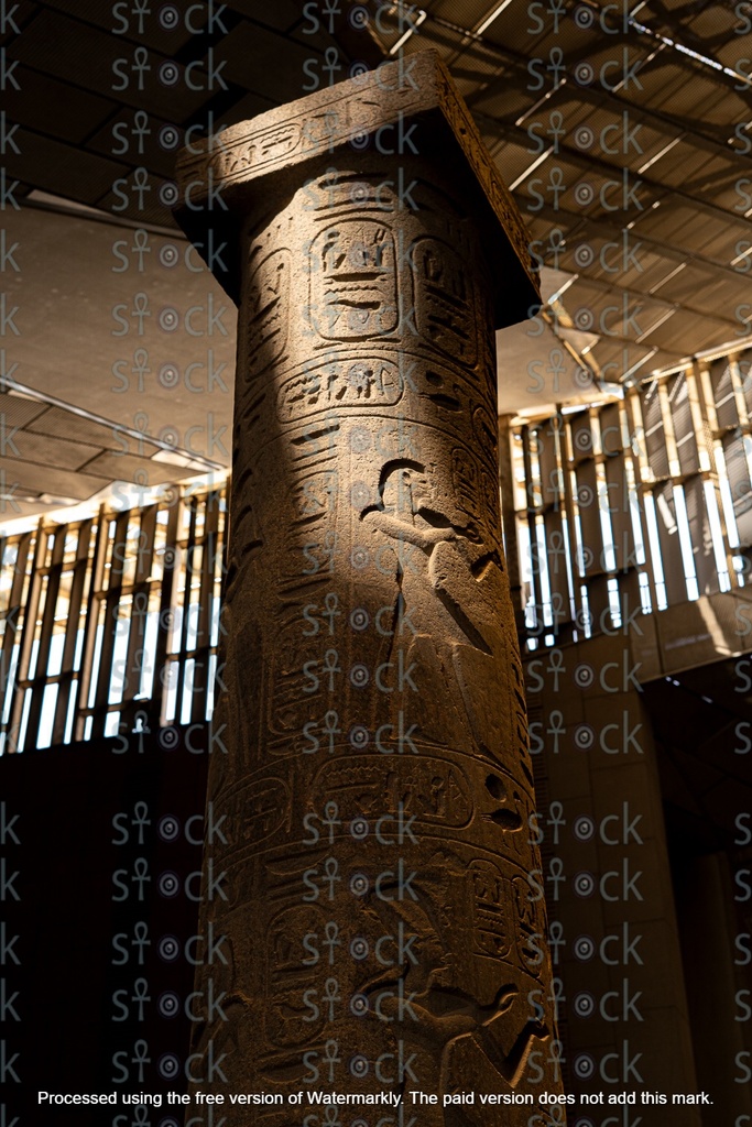 An ancient Egyptian statue wearing a crown.