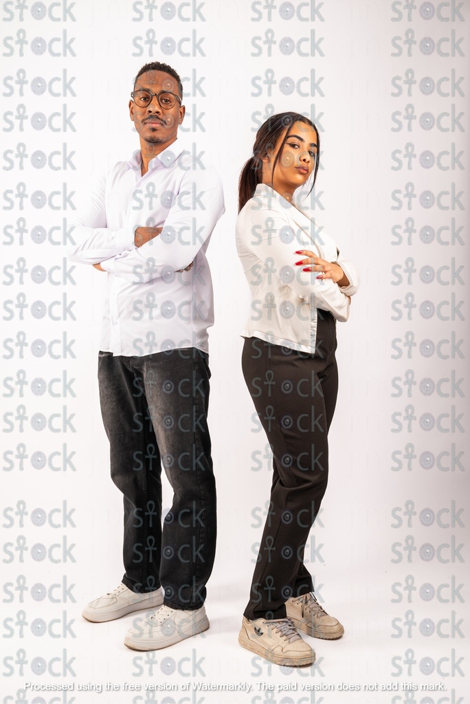 Young man and woman wearing white shirts standing back to back
