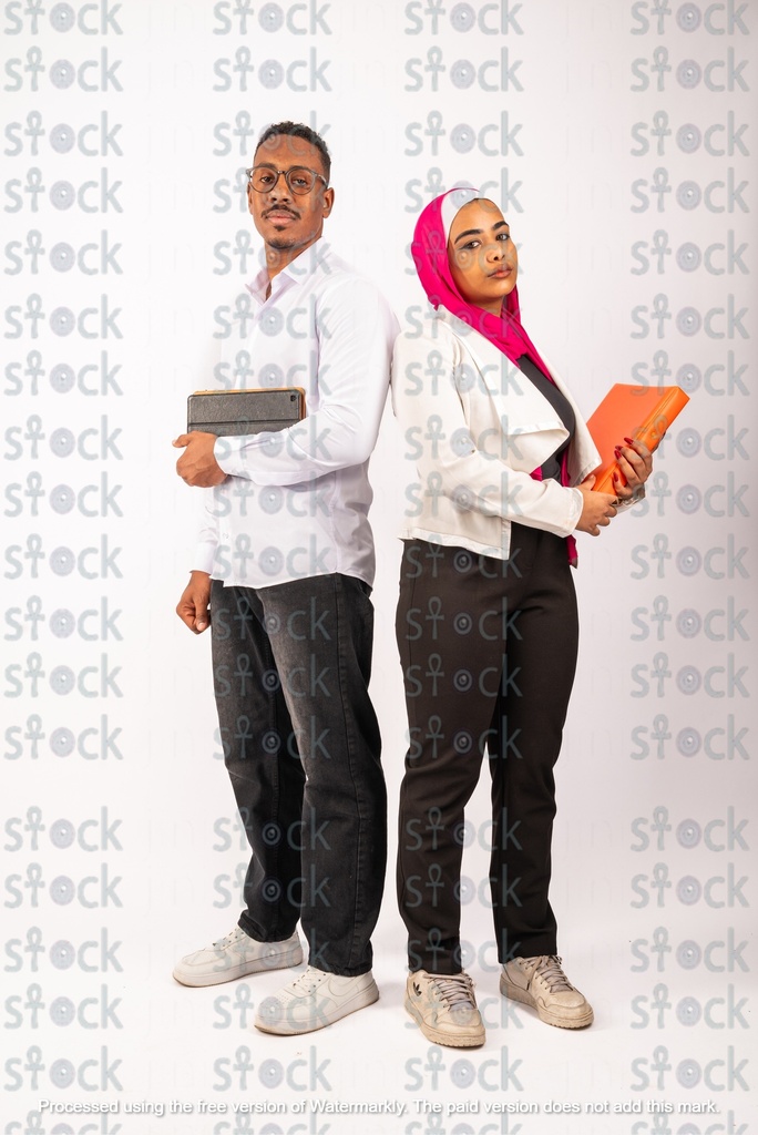 A Nubian young man and woman standing back to back holding their pendants