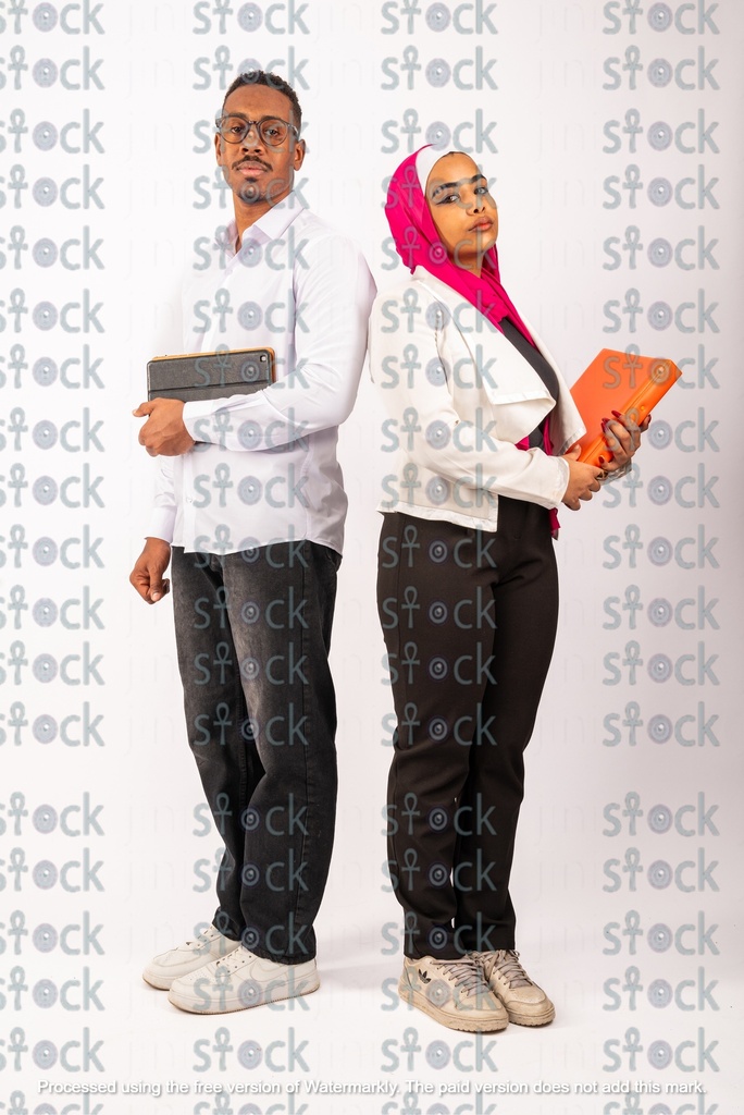Veiled Nubian girl standing back to back with a Nubian young man
