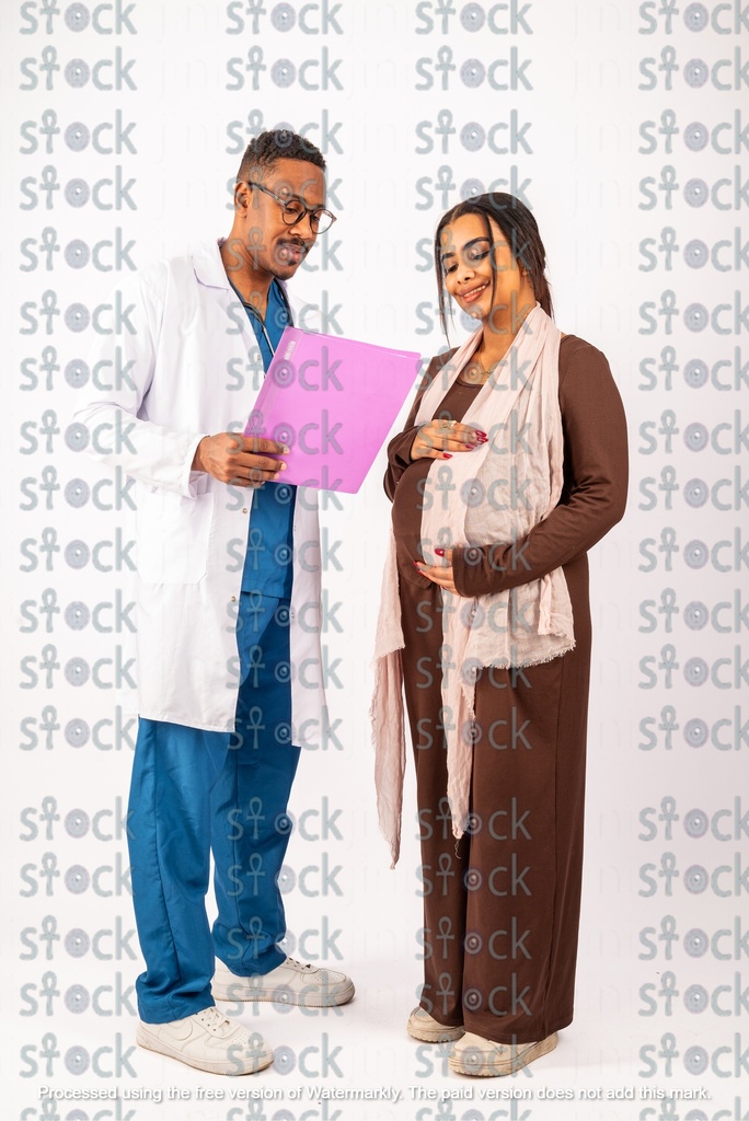 Nubian mother and doctor looking at the file