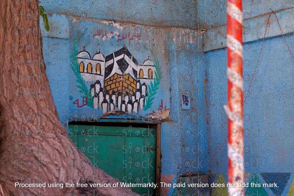 Drawing the Holy Kaaba on the walls