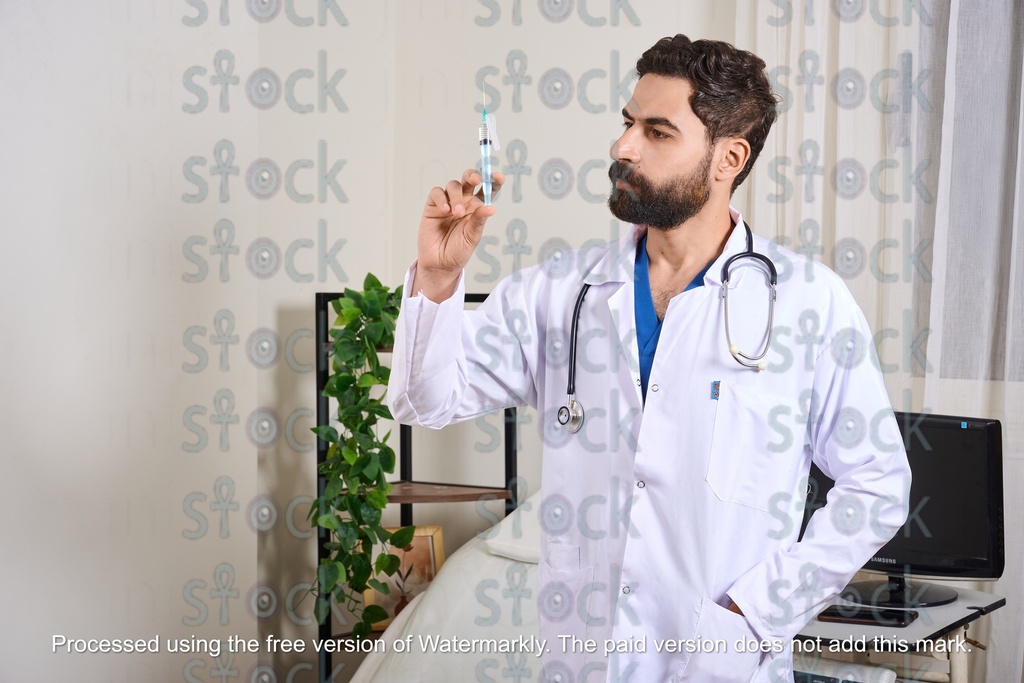 Doctor holding a medical syringe