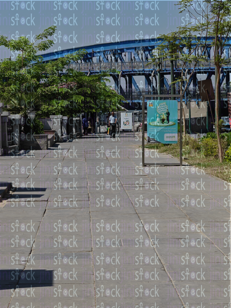 The Egyptian people's walkway is decorated with trees and buildings 