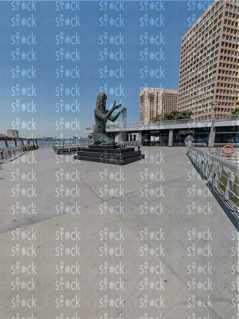 The mermaid statue from the Egyptian walkway, amidst the cafes