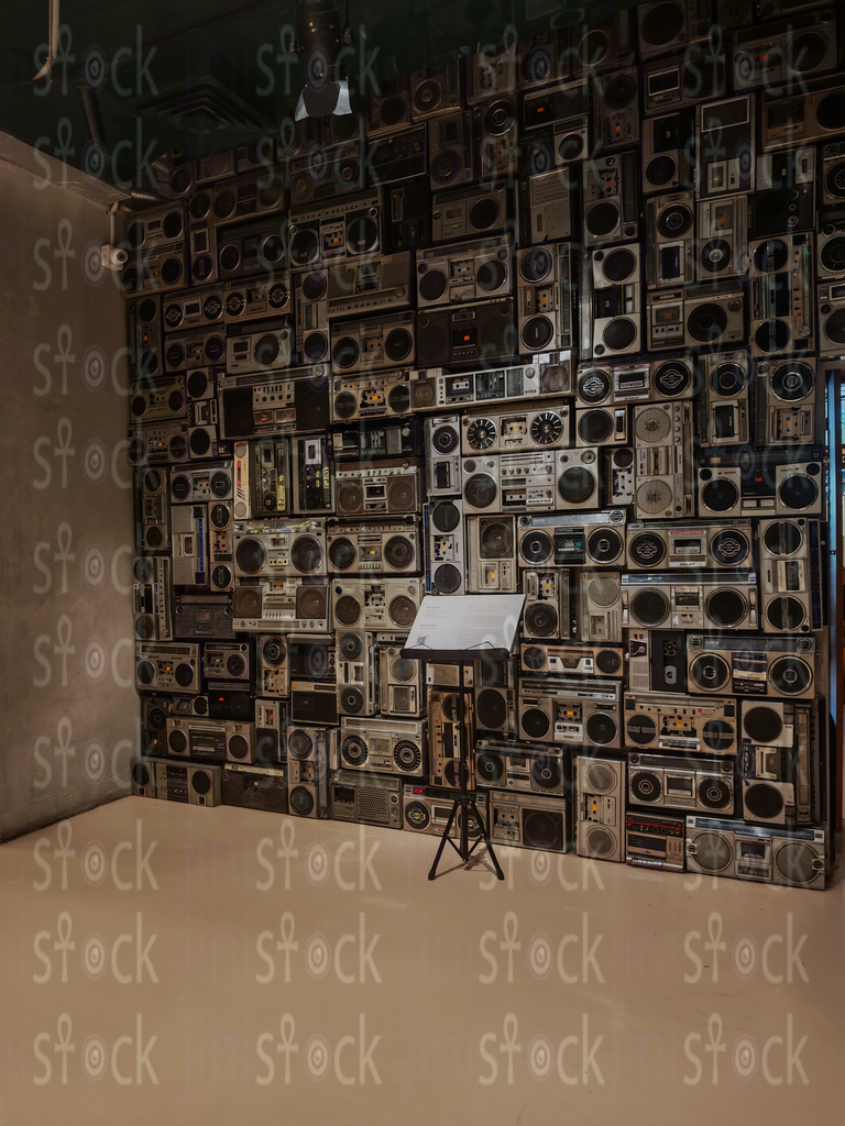 An art wall of vintage boomboxes