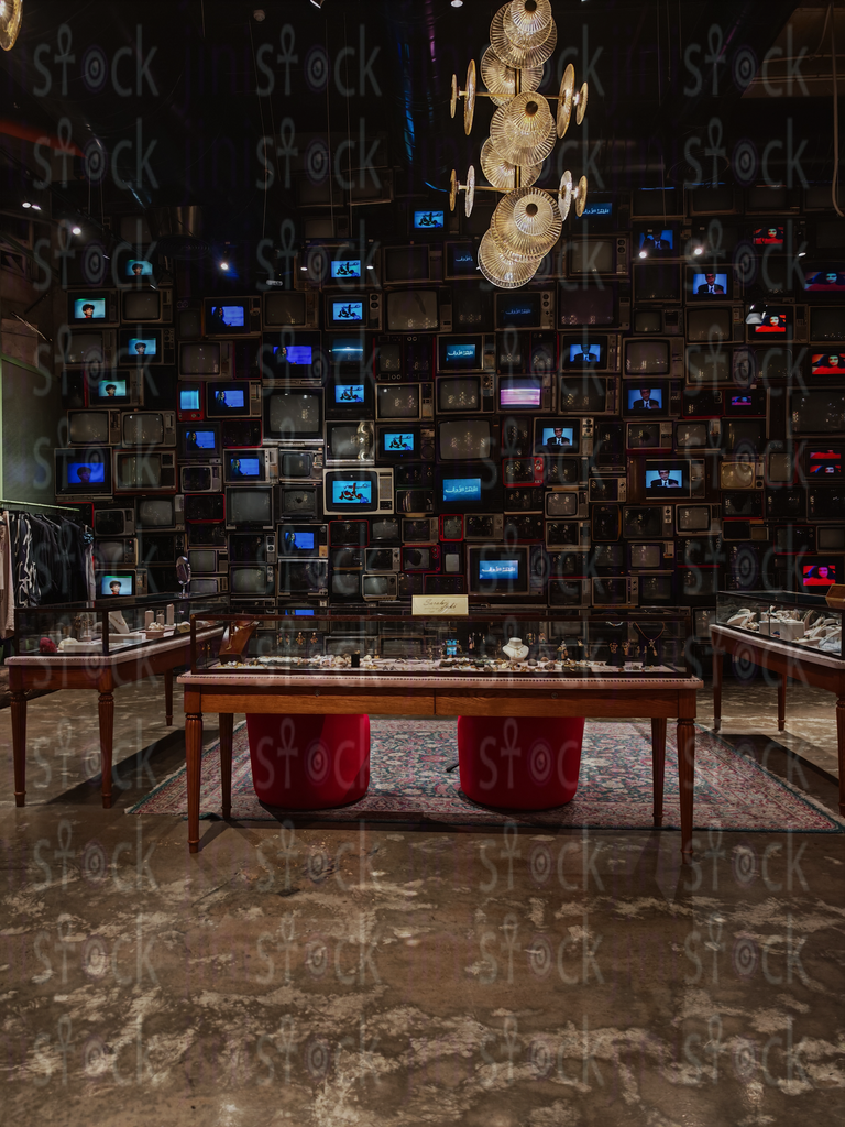 Jewelry display in front of TVs