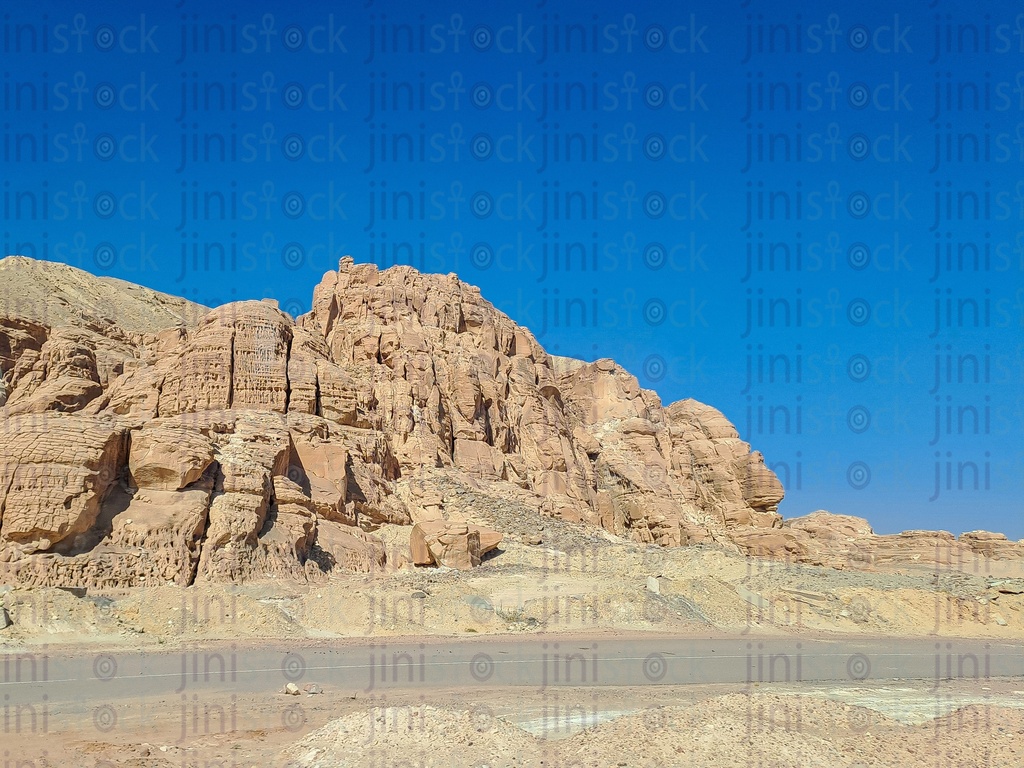 The mountains of South Sinai and a road. it can be used as a background for designs.