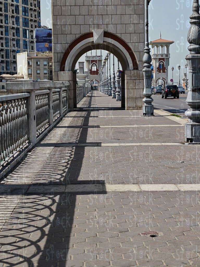 Walking Path under Arches of Bridge