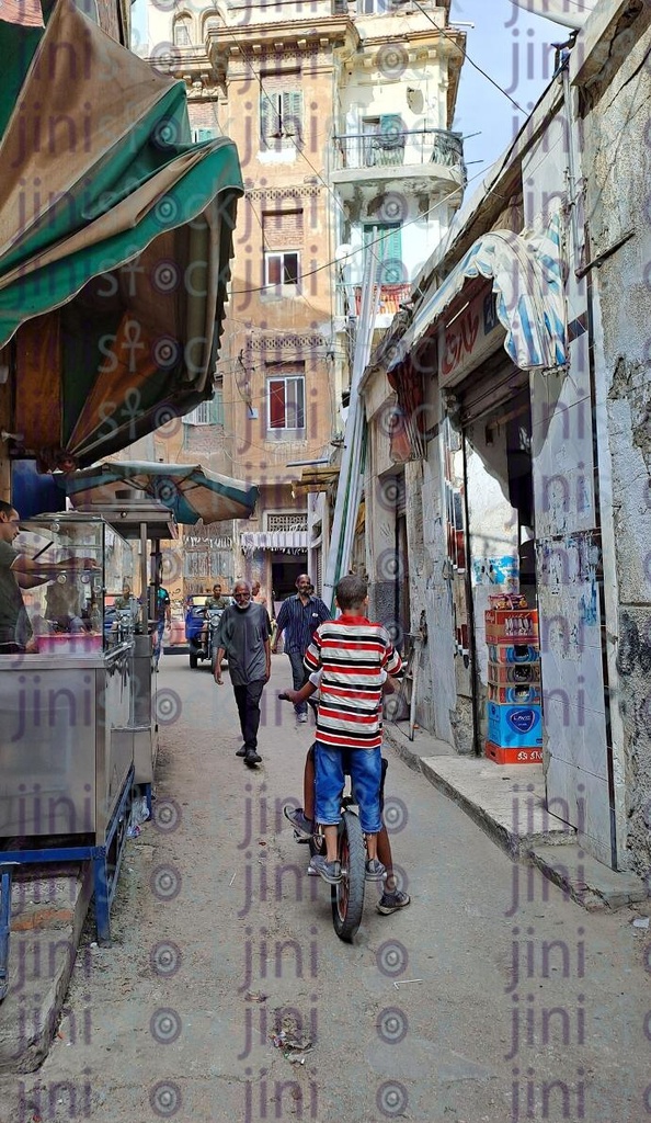 Kom El dekka street in Alexandria,Egypt and a kid driving a bicycle كوم الدكة بالاسكندريا