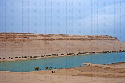 The Magic Lake in Fayoum. a Mountain, sands, and a lake in the desert of Fayoum, Egypt: البحيرة المسحورة بالفيوم